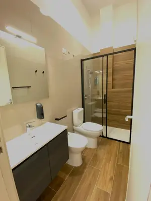 a bathroom with a toilet and a sink and a shower at Medusa -IN CENTRO, ARIA CONDIZIONATA e NO ZTL -CITY CENTRE, AIRCON, NO LTZ in Castellammare del Golfo