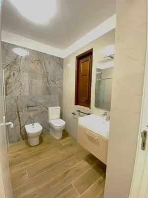 a bathroom with a toilet and a sink at Medusa -IN CENTRO, ARIA CONDIZIONATA e NO ZTL -CITY CENTRE, AIRCON, NO LTZ in Castellammare del Golfo