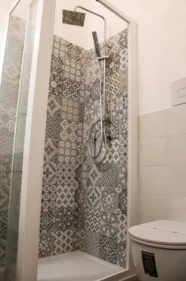a bathroom with a shower and a toilet at Casa Turà in Isola delle Femmine