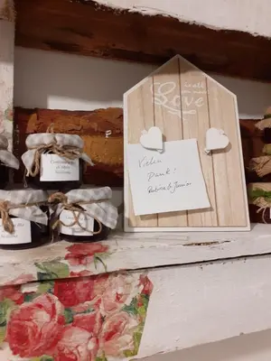 a couple of signs on a shelf with shoes at Franco-Home in Palermo