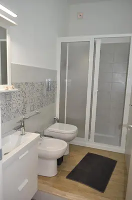 a bathroom with a toilet and a sink and a shower at Casa Vacanze Monte Cofano in Macari