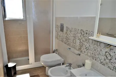 a bathroom with a toilet and a sink at Casa Vacanze Monte Cofano in Macari
