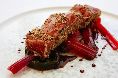 a white plate with a piece of food on it at Principe Alogna Hotel & SPA in Altavilla Milicia