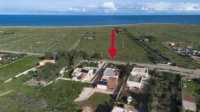 an aerial view of a house with a red arrow at Casa Laura di fronte la Tonnara in San Vito lo Capo