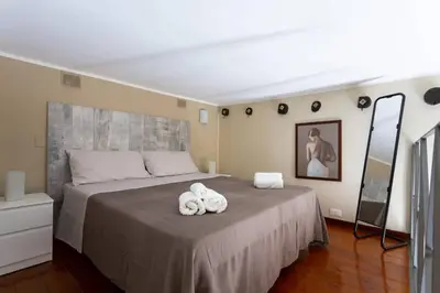 a bedroom with a bed with towels on it at Da Mari e Paolo in Palermo