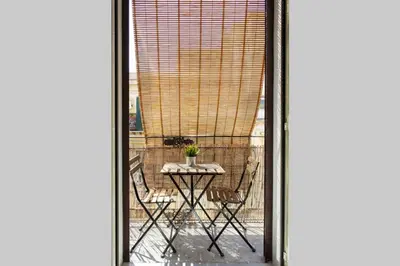a view of a patio with a table and chairs at Da Mari e Paolo in Palermo