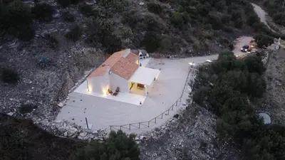 an overhead view of a small white house with a roof at Villa Futura in Scopello
