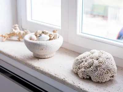 a bowl of stuffed animals sitting on a window sill at Tannur B&B in Castellammare del Golfo