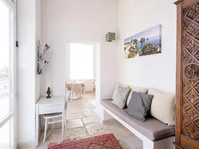 a living room with a couch and a table at Tannur B&B in Castellammare del Golfo