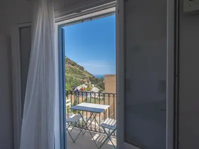 a view from the balcony of a room with a table at Tannur B&B in Castellammare del Golfo