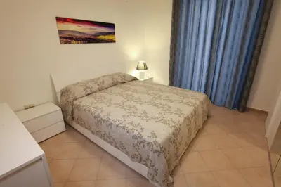 a bedroom with a bed in a room with a window at Afrodite appartamento Ballarò in Palermo