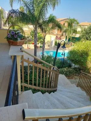 a set of stairs leading to a swimming pool at Villa Summer in Trappeto