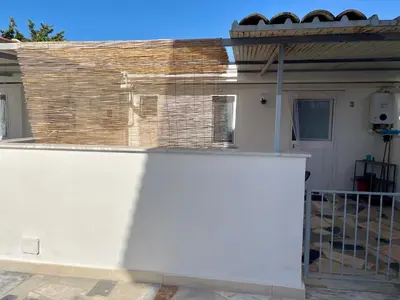 a white fence in front of a house at VILLA MOGUNTIA in Ficarazzi
