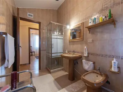 a bathroom with a sink and a shower and a toilet at Villa with Pool, Pets & WiFi in Misilmeri