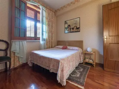 a bedroom with a bed and a window at Villa with Pool, Pets & WiFi in Misilmeri