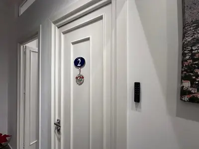 a white door with a clock on it at Carpe Diem Rooms by Marino Tourist in Palermo