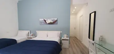 a bedroom with two beds and a glass floor at Carpe Diem Rooms by Marino Tourist in Palermo