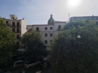 a view of a city with buildings and trees at B&B Liberty in Palermo