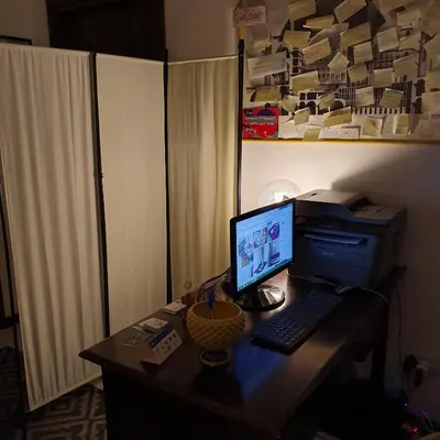 a desk with a computer and a printer on it at Alba central City in Palermo