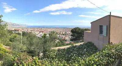a view of a city from a house at villa Sun in Alcamo