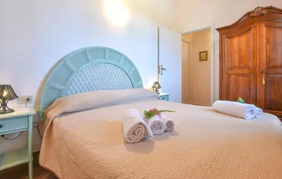 a bedroom with a bed with towels on it at Villa Trappeto in Trappeto