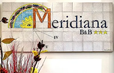 a sign on a wall that reads nederlandalam bcbc at Meridiana B&B in Palermo