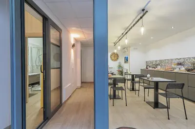 a dining room and kitchen with tables and chairs at Meridiana B&B in Palermo