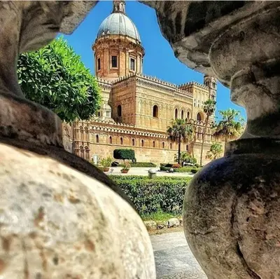 a large building with a tower on top of it at Ncantu home in Palermo
