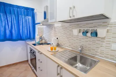 a kitchen with a sink and a counter top at Ncantu home in Palermo