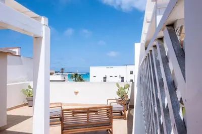 a balcony with chairs and a view of the ocean at Casa Greta a due passi dal mare in San Vito lo Capo