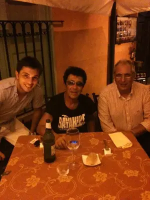 a group of three men sitting at a table at Franco Il Conte in Bagheria