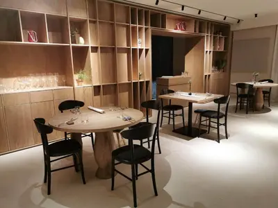 a restaurant with two tables and chairs in a room at Franco Il Conte in Bagheria