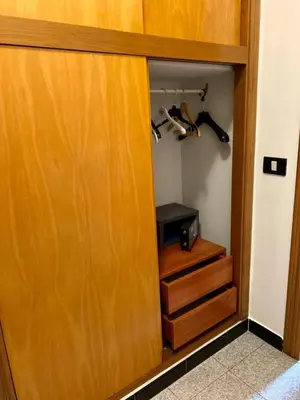 a closet with a wooden door and some stairs at Franco Il Conte in Bagheria
