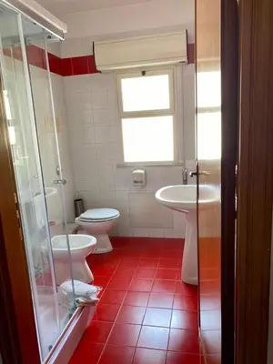 a bathroom with two toilets and a sink at Franco Il Conte in Bagheria