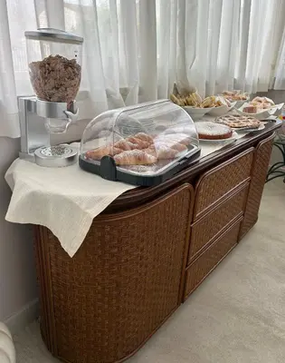 a buffet with pastries and other food on a table at Franco Il Conte in Bagheria