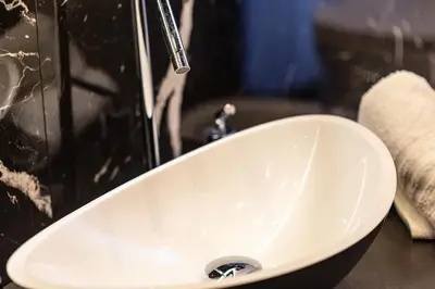 a white sink with a faucet in a bathroom at Maximum Suite & Spa in Palermo