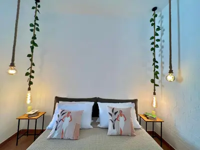 a bedroom with a bed with four people on it at da Mumminedda in Cinisi