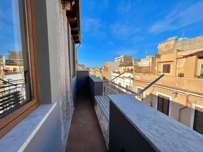 a balcony with a view of a city at da Mumminedda in Cinisi