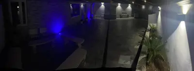 a blue light on the side of a building at LA CASA DELLE FATE-Area Marina Protetta in Isola delle Femmine