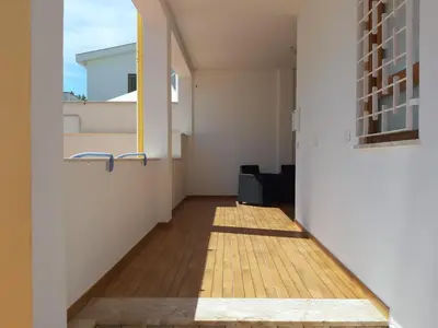 a hallway of a house with a wooden floor at Mondello Sabrina Apartments in Mondello