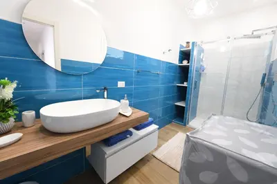 a bathroom with a sink and a mirror at Terra Sinus Beautiful Suite in Terrasini