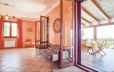 a living room with a couch and a table at Villa indipendente in Altavilla Milicia