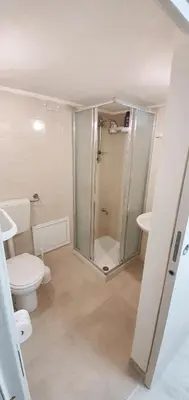a bathroom with a shower and a toilet and a sink at Romantic apartment with sea view in Alcamo - Terrace & BBQ in Alcamo