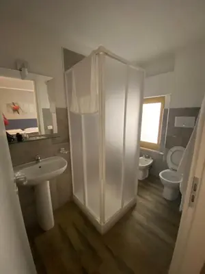 a bathroom with a shower and a sink and toilet at BONORUM De Spuches in Palermo