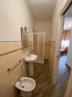 a bathroom with a toilet and a sink at BONORUM De Spuches in Palermo