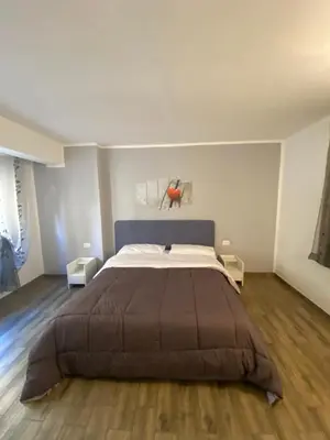 a bedroom with a large bed in a room at BONORUM De Spuches in Palermo
