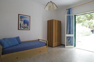 a bathroom with a sink and a mirror at Villa Teti - Sicilia in Campofelice di Roccella