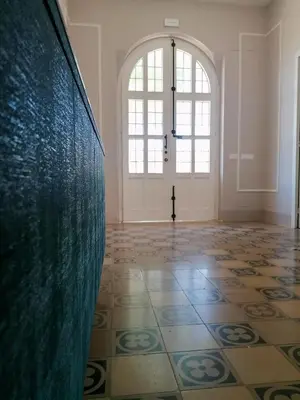 an empty room with a tile floor and a large window at Bri&Bri Mondello in Palermo