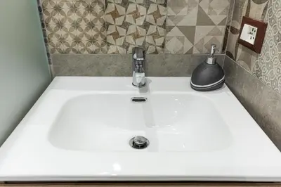 a bathroom sink with a faucet on top of it at Casa Vacanze del Corso in Bagheria