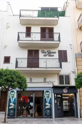 a store front of a building with posters on it at Casa Vacanze del Corso in Bagheria